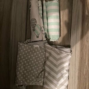 Baby swaddlers and baby swaddle blankets